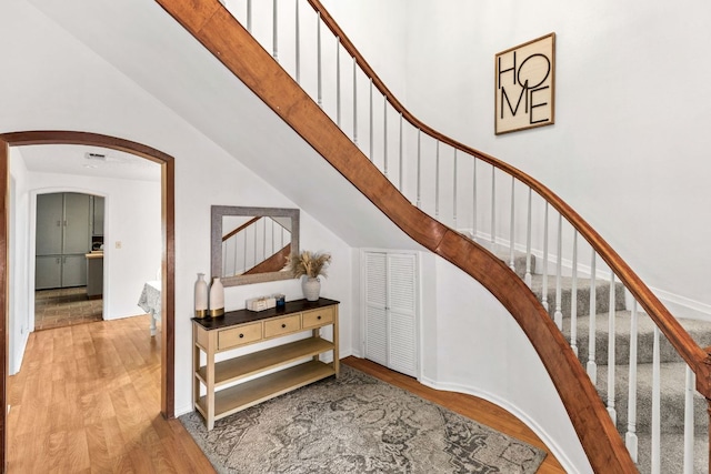 116 S Hackberry Ave, Luling, TX 78648 - staircase with wood finished floors and arched walkways
