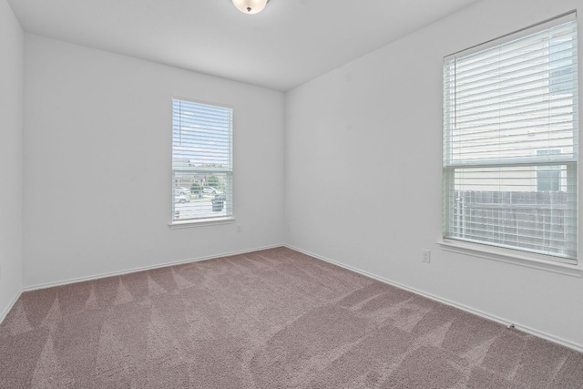195 Azure Cv, Kyle, TX 78640 - spare room featuring carpet flooring and baseboards