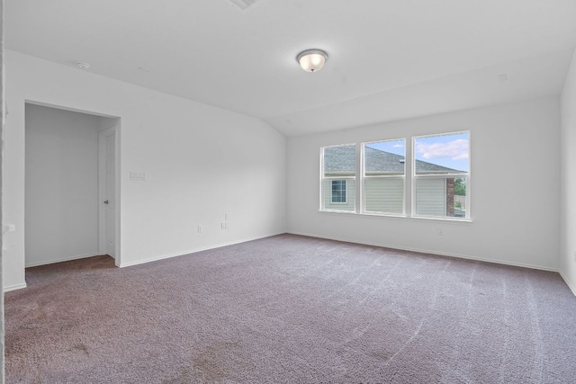 195 Azure Cv, Kyle, TX 78640 - carpeted empty room featuring lofted ceiling and baseboards