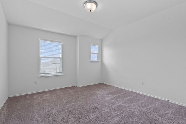 195 Azure Cv, Kyle, TX 78640 - carpeted empty room featuring vaulted ceiling and baseboards