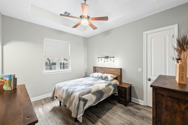 7617 Lazy River Cv, Austin, TX 78730 - bedroom featuring wood finished floors, baseboards, and a ceiling fan