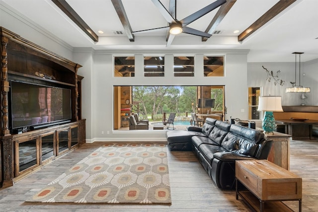 7617 Lazy River Cv, Austin, TX 78730 - living room with wood finished floors, beamed ceiling, and ceiling fan