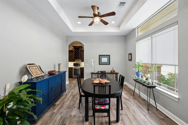 7617 Lazy River Cv, Austin, TX 78730 - dining space with beverage cooler, plenty of natural light, ceiling fan, light wood-type flooring, and recessed lighting