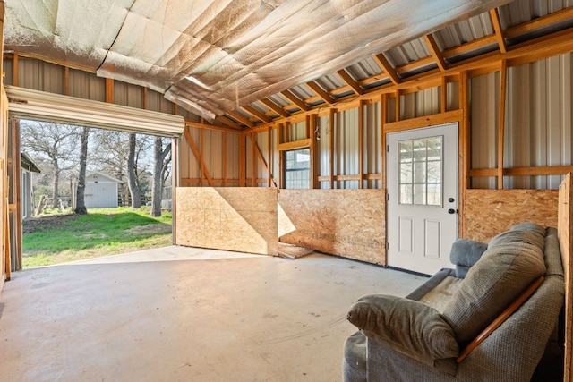 180 Bradley Ln, Rosanky, TX 78953 - miscellaneous room featuring unfinished concrete floors, lofted ceiling, and healthy amount of natural light