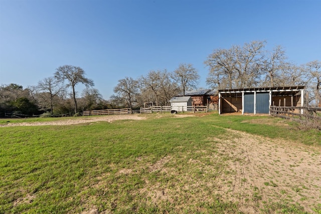 180 Bradley Ln, Rosanky, TX 78953 - view of yard with an exterior structure, an outbuilding, and a view of rural / pastoral area