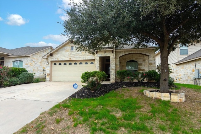 1811 Sand Creek Rd, Cedar Park, TX 78613 - view of front facade featuring stone siding, an attached garage, and concrete driveway