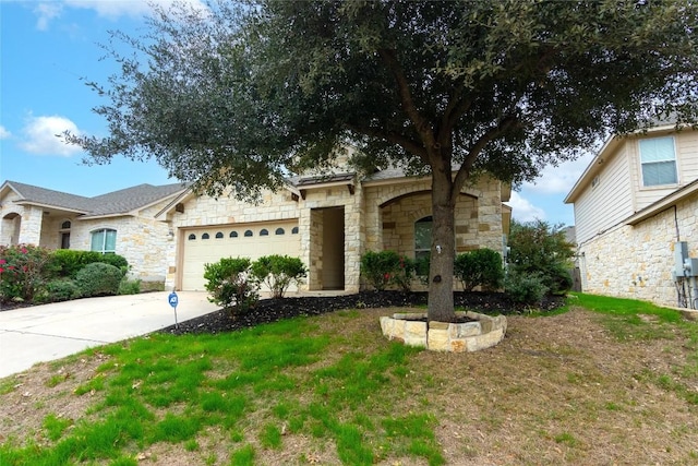 1811 Sand Creek Rd, Cedar Park, TX 78613 - view of front of home featuring stone siding, an attached garage, and concrete driveway