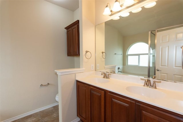1811 Sand Creek Rd, Cedar Park, TX 78613 - full bath with double vanity, toilet, baseboards, and tile patterned flooring