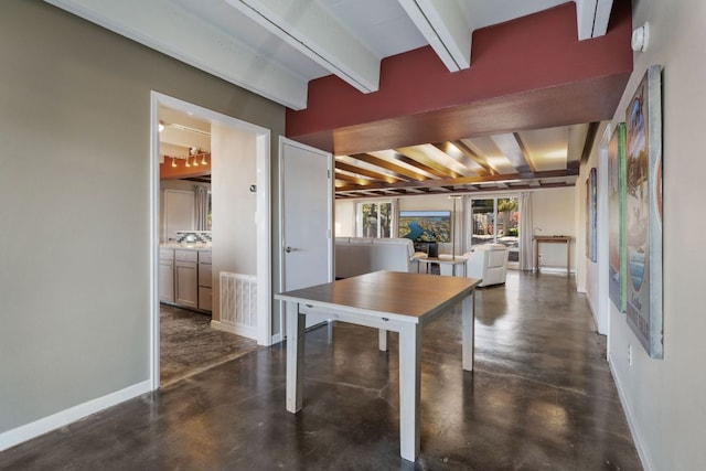 421 Yucca Dr, Kingsland, TX 78639 - dining space with beamed ceiling and concrete floors