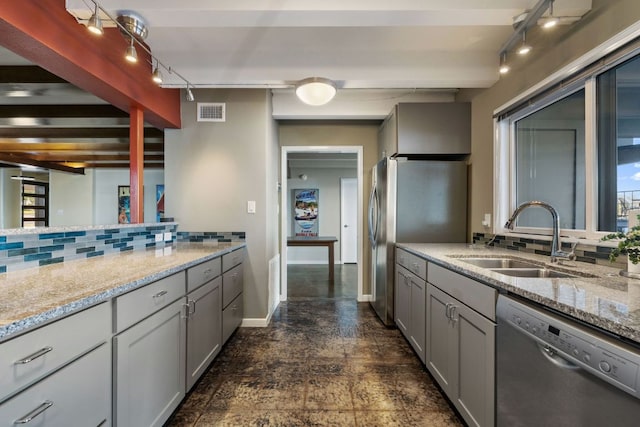 421 Yucca Dr, Kingsland, TX 78639 - kitchen with stainless steel appliances, tasteful backsplash, gray cabinets, light stone countertops, and beamed ceiling