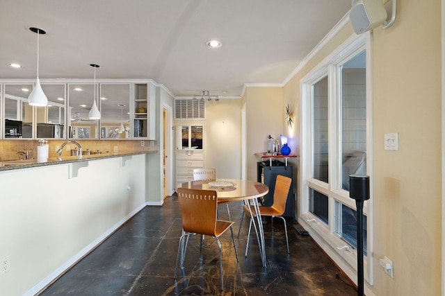 421 Yucca Dr, Kingsland, TX 78639 - dining space with concrete floors, ornamental molding, and recessed lighting