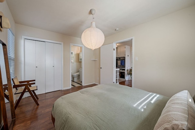 4701 Sylvandale Dr Unit 1, Austin, TX 78745 - bedroom featuring dark wood-style flooring, a closet, and connected bathroom