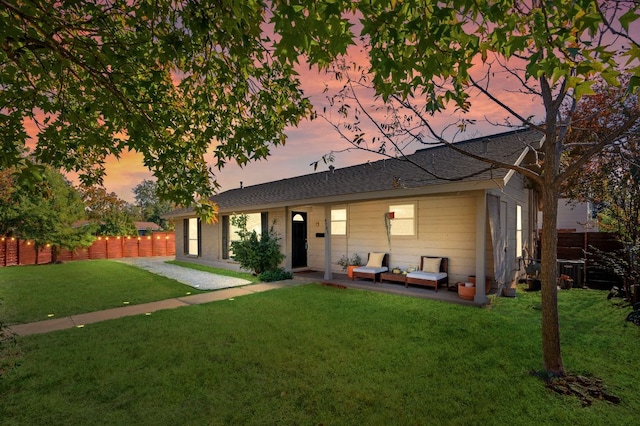 4701 Sylvandale Dr Unit 1, Austin, TX 78745 - view of front of home featuring a fenced backyard, a patio area, and roof with shingles