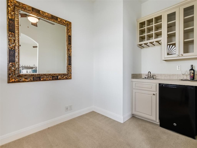 17545 E Reed Parks Rd Unit 5, Jonestown, TX 78645 - indoor wet bar with black dishwasher, light colored carpet, baseboards, and a ceiling fan