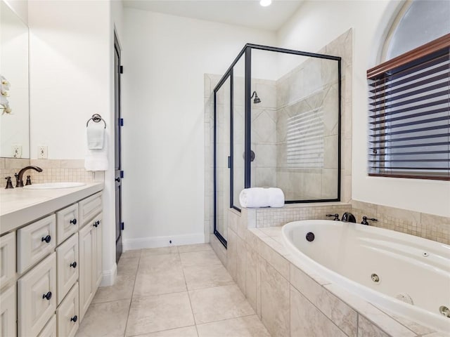 17545 E Reed Parks Rd Unit 5, Jonestown, TX 78645 - bathroom with a whirlpool tub, a stall shower, vanity, tile patterned flooring, and tasteful backsplash