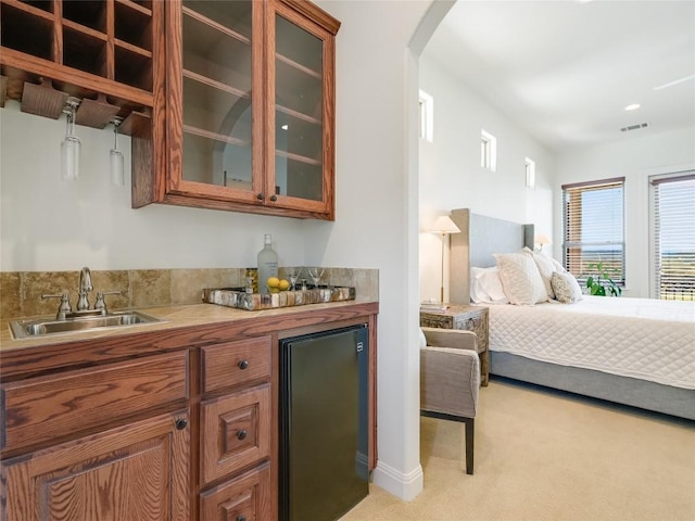 17545 E Reed Parks Rd Unit 5, Jonestown, TX 78645 - indoor wet bar with light colored carpet, refrigerator, and arched walkways