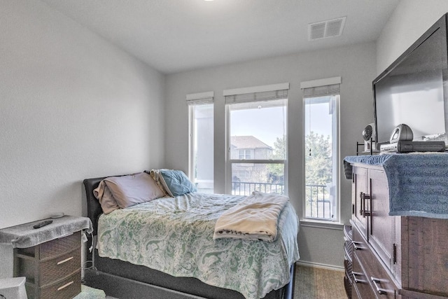 1062 Bowline Dr, Georgetown, TX 78633 - bedroom featuring baseboards and dark carpet