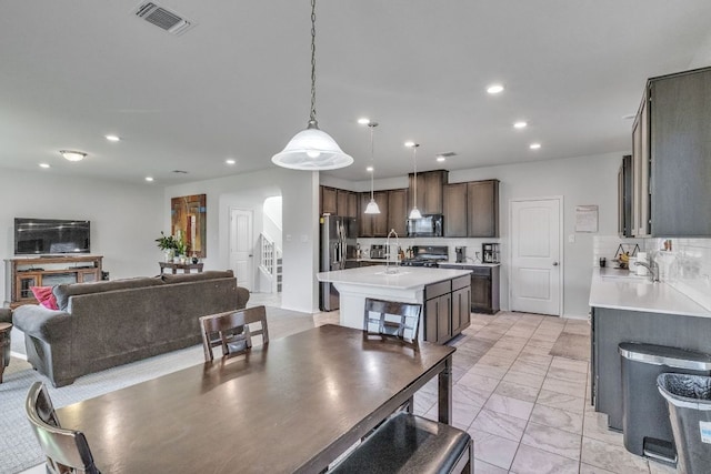 1062 Bowline Dr, Georgetown, TX 78633 - dining space featuring arched walkways, recessed lighting, and light marble finish flooring