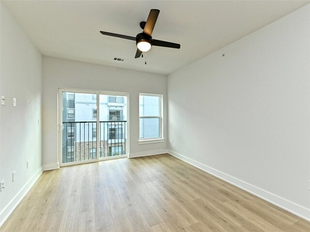 2500 Longview St Unit 518, Austin, TX 78705 - empty room with light wood-style floors, ceiling fan, and baseboards