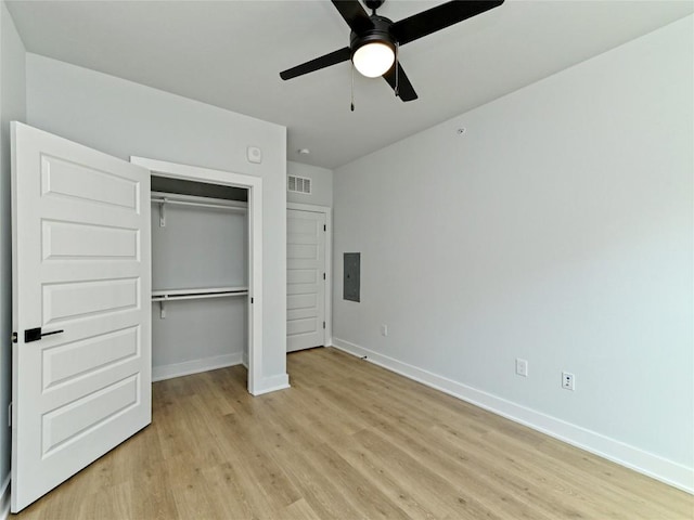 2500 Longview St Unit 518, Austin, TX 78705 - unfurnished bedroom featuring electric panel, light wood finished floors, baseboards, and a closet