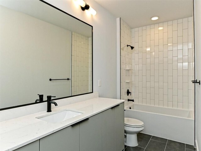 2500 Longview St Unit 518, Austin, TX 78705 - full bathroom with vanity, tile patterned flooring, toilet, and washtub / shower combination
