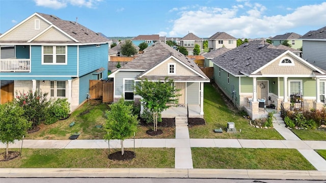 310 Spiny Lizard Ln, San Marcos, TX 78666 - view of front of home with a porch, a residential view, and a front yard