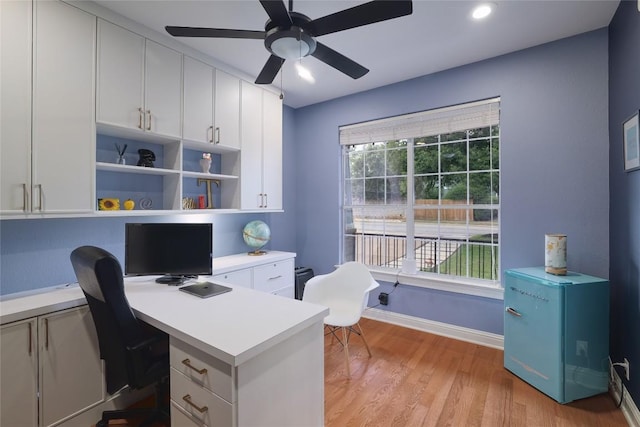 6305 Carrington Dr, Austin, TX 78749 - home office with a ceiling fan, built in desk, light wood-style floors, recessed lighting, and baseboards