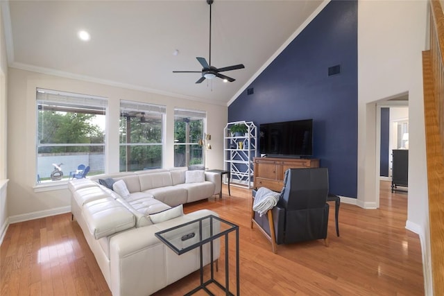 6305 Carrington Dr, Austin, TX 78749 - living room with crown molding, ceiling fan, baseboards, light wood-style flooring, and high vaulted ceiling