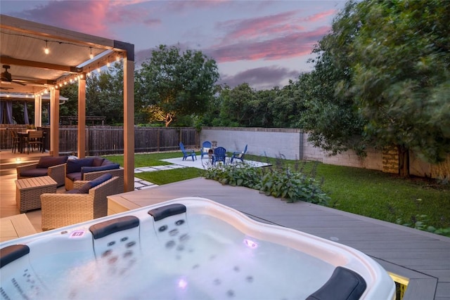 6305 Carrington Dr, Austin, TX 78749 - patio terrace at dusk featuring outdoor dining area, ceiling fan, an outdoor hot tub, and a wooden deck