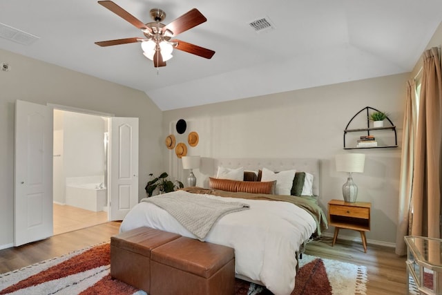 606 Indian Run Dr, Pflugerville, TX 78660 - bedroom with lofted ceiling, light wood finished floors, ensuite bath, and a ceiling fan