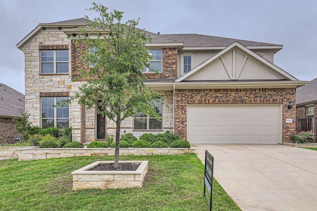 508 Landing Ln, Leander, TX 78641 - view of front of property with concrete driveway, a front yard, stucco siding, and brick siding