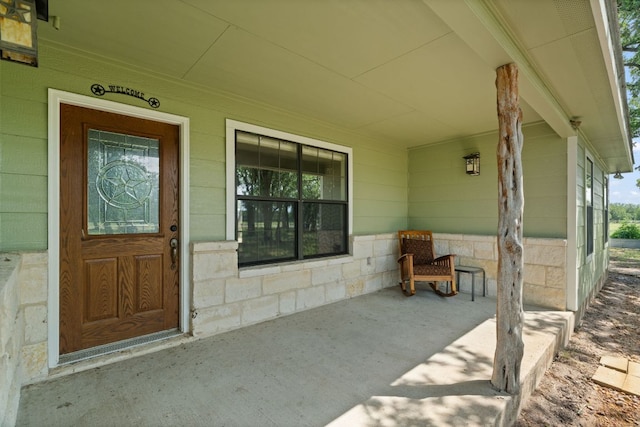 3434 Prairie Lea Rd, Kingsbury, TX 78638 - view of exterior entry with covered porch and concrete block siding