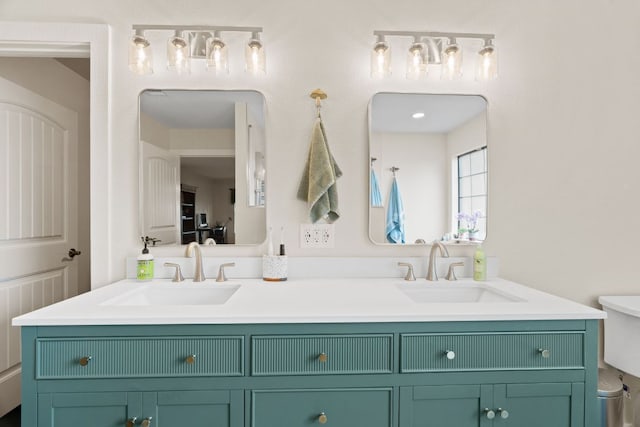 3434 Prairie Lea Rd, Kingsbury, TX 78638 - bathroom featuring double vanity and toilet
