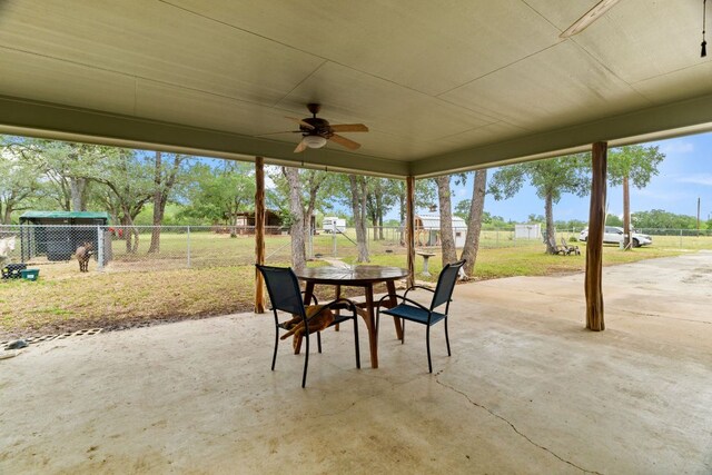3434 Prairie Lea Rd, Kingsbury, TX 78638 - fenced backyard with a patio area, outdoor dining area, and a ceiling fan
