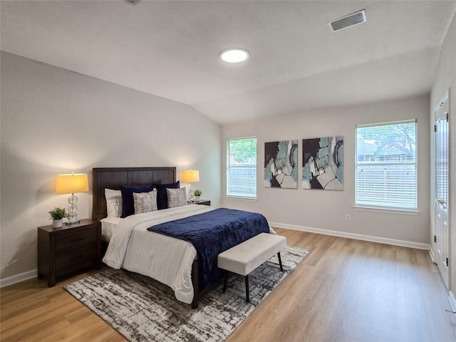 9403 Tea Rose Trl, Austin, TX 78748 - bedroom with light wood-style flooring, baseboards, and lofted ceiling