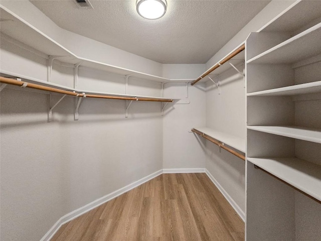 9403 Tea Rose Trl, Austin, TX 78748 - walk in closet featuring wood finished floors