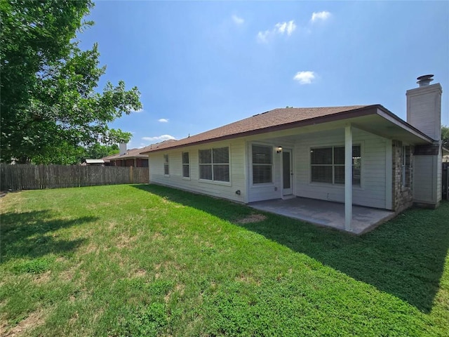 9403 Tea Rose Trl, Austin, TX 78748 - rear view of house with a patio area and a chimney