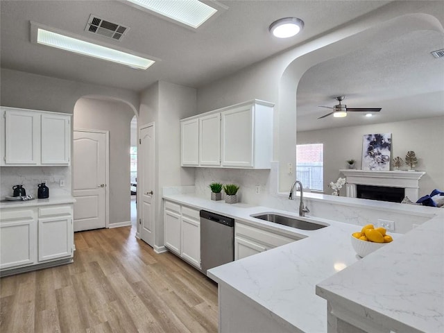 9403 Tea Rose Trl, Austin, TX 78748 - kitchen featuring a sink, dishwasher, arched walkways, and ceiling fan