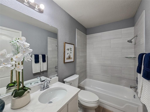 9403 Tea Rose Trl, Austin, TX 78748 - bathroom with vanity, toilet, shower / washtub combination, a textured ceiling, and a textured wall