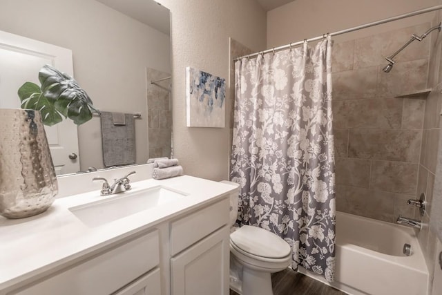 108 Berkeley Pl, Georgetown, TX 78628 - full bathroom with vanity, toilet, shower / bath combo, wood finished floors, and a textured wall