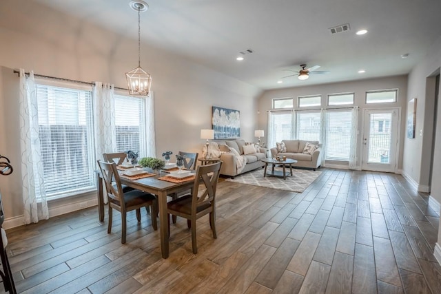 108 Berkeley Pl, Georgetown, TX 78628 - dining area with a ceiling fan, dark wood-style floors, a chandelier, recessed lighting, and baseboards