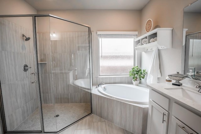 108 Berkeley Pl, Georgetown, TX 78628 - full bath featuring a garden tub, vanity, and a stall shower