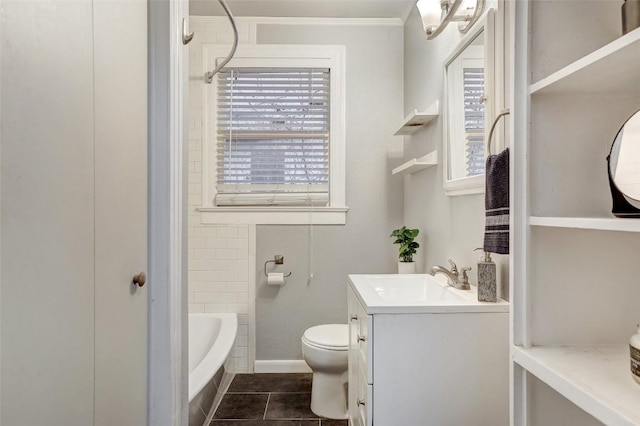 1309 E 13th St, Austin, TX 78702 - bathroom with ornamental molding, vanity, toilet, and tile patterned floors