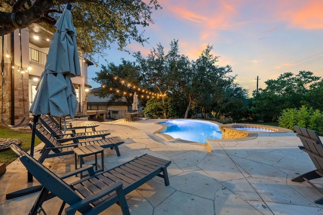 7609 Lazy River Cv, Austin, TX 78730 - view of swimming pool featuring a patio area and a pool with connected hot tub