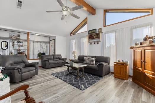 2305 Canyon Creek Dr, Temple, TX 76502 - living area with beam ceiling, a ceiling fan, high vaulted ceiling, and light wood-style floors