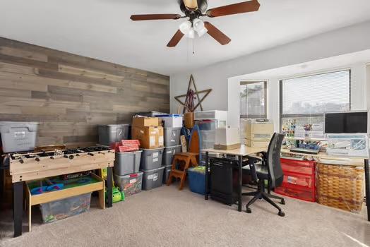 2305 Canyon Creek Dr, Temple, TX 76502 - office featuring ceiling fan, wood walls, and carpet flooring