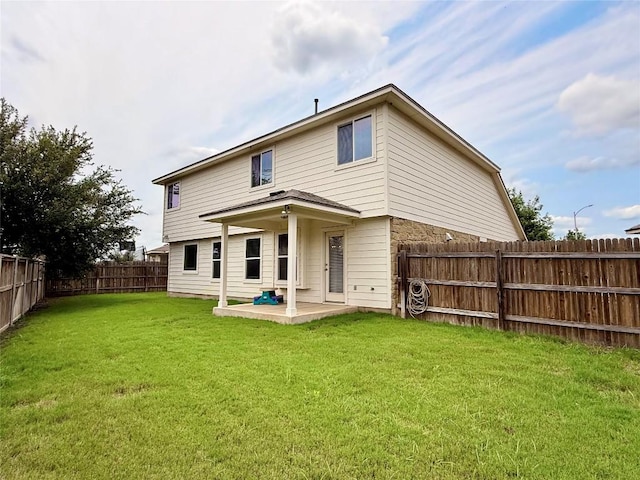 110 Carbine Ct, Bastrop, TX 78602 - rear view of house with a patio area