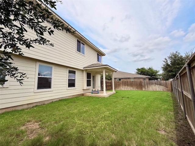 110 Carbine Ct, Bastrop, TX 78602 - rear view of house with a patio area