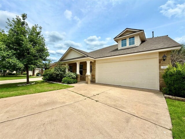 110 Carbine Ct, Bastrop, TX 78602 - craftsman-style home featuring driveway, an attached garage, a front yard, a shingled roof, and a porch