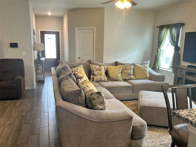 520 Warlander Way, Georgetown, TX 78626 - living area with ceiling fan, wood finished floors, and baseboards